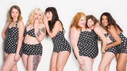 Three women wearing polka dot swimwear