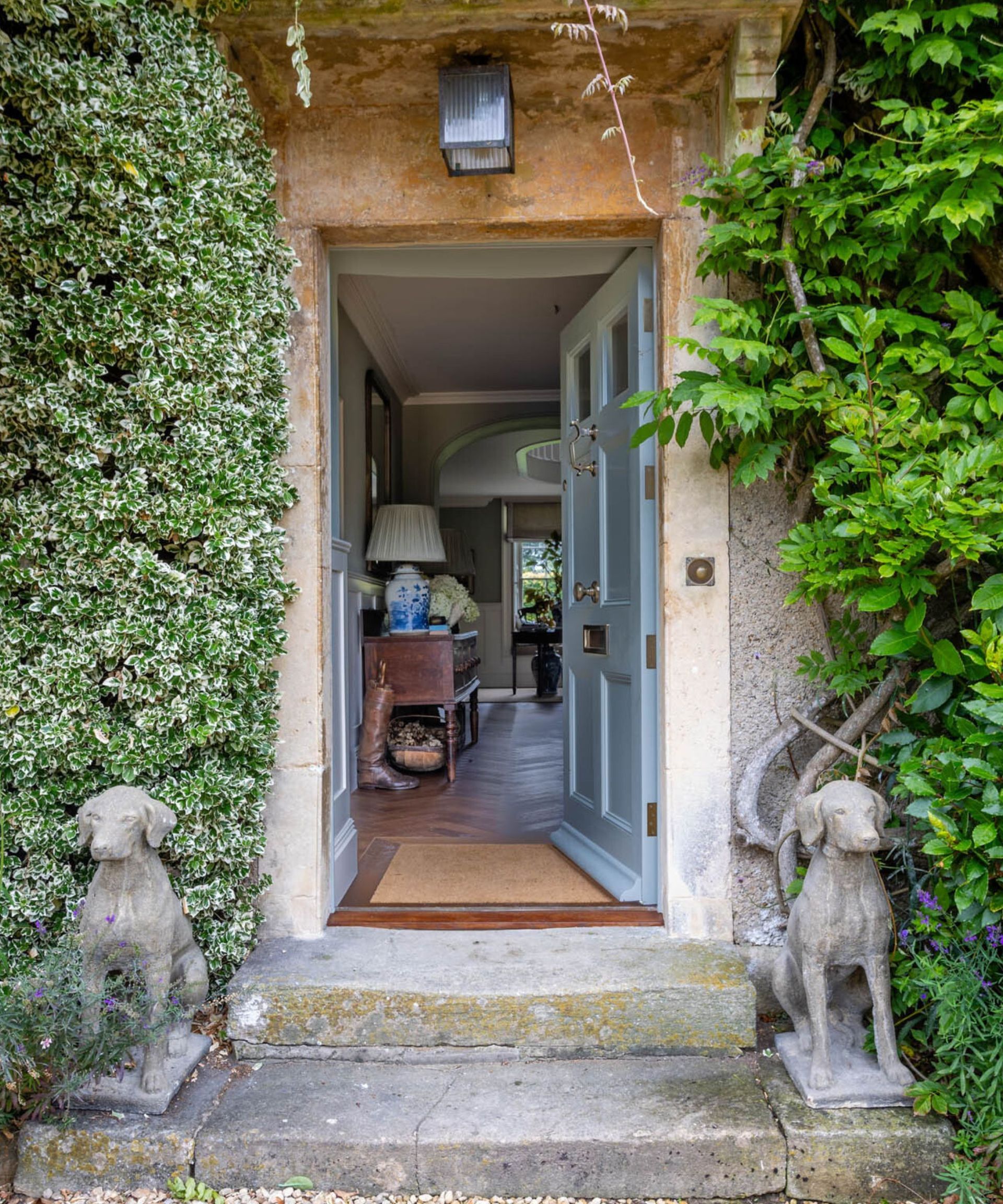 The front door to a country house, painted in baby blue