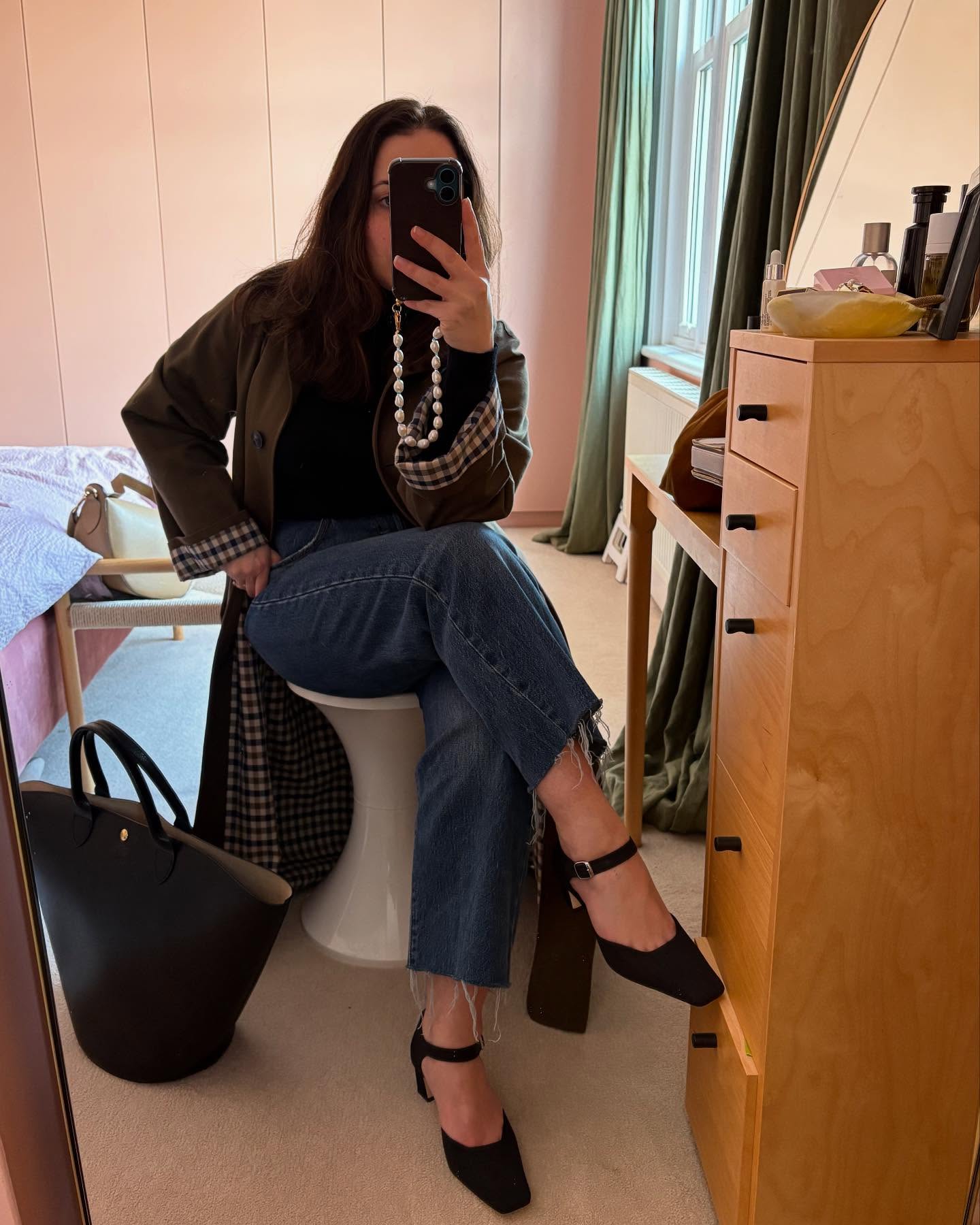 An image of @hannahalmassi wearing a turtleneck from Theory.