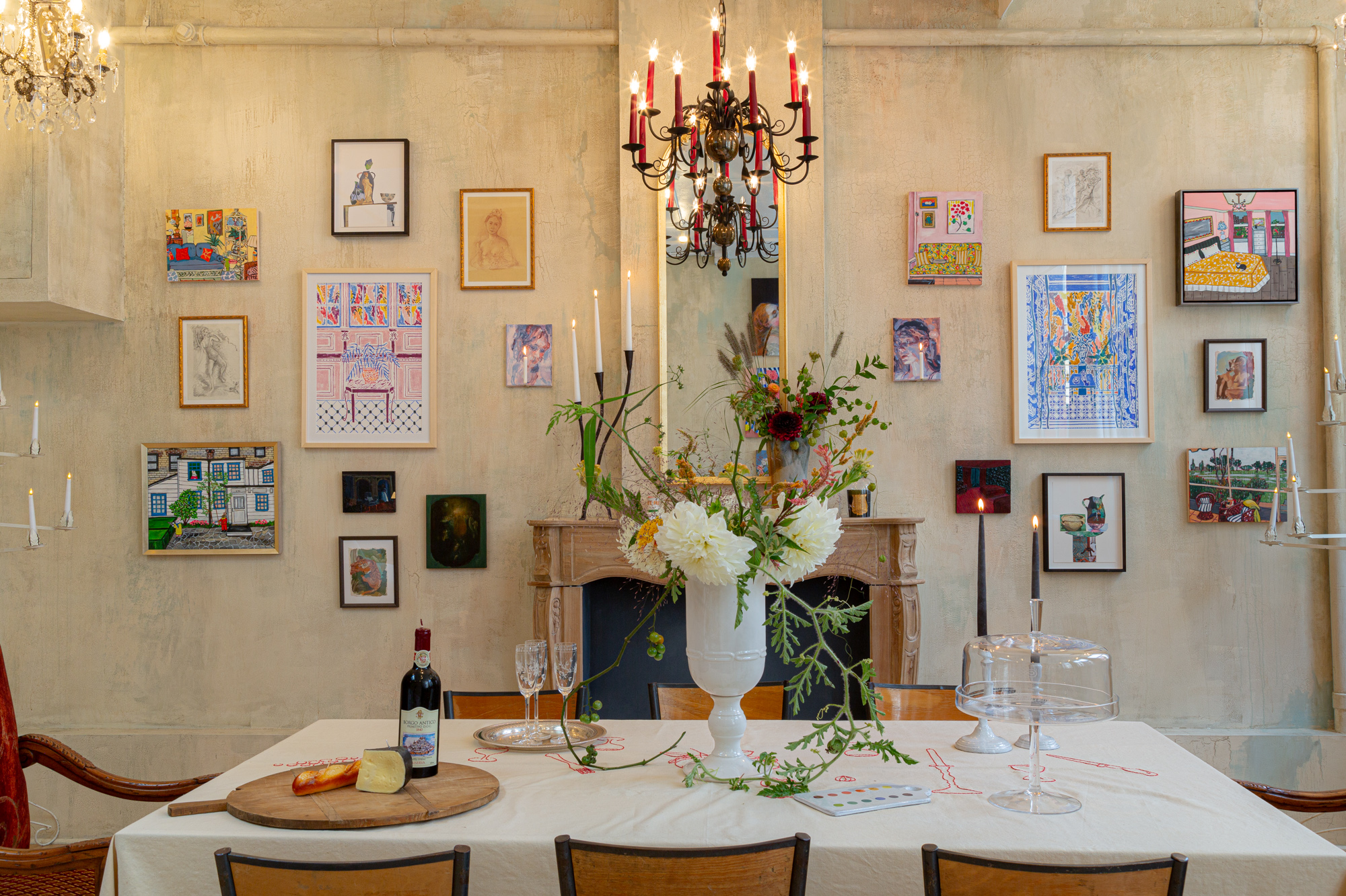 Dining room featuring elaborate candle sconces disguised as wall art