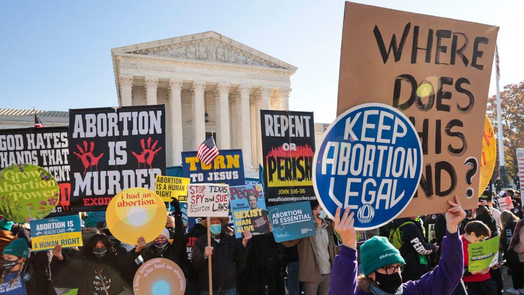 Pro-choice and anti-abortion activists at a protest.