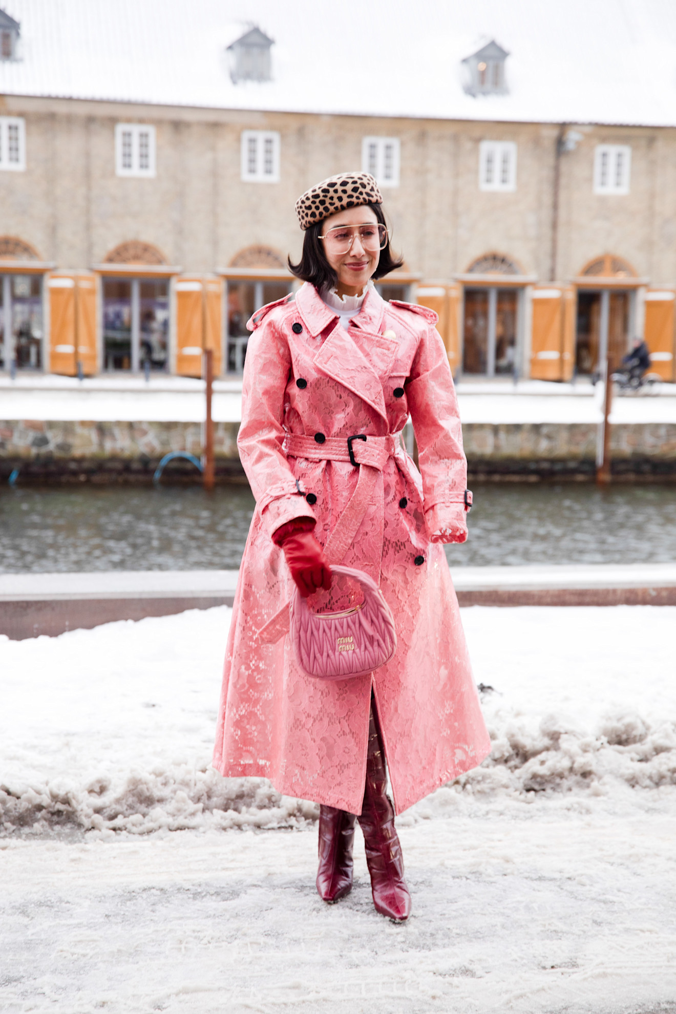 April Lockhart wearing a pink vintage burberry coat and leopard print hat at Copenhagen Fashion Week