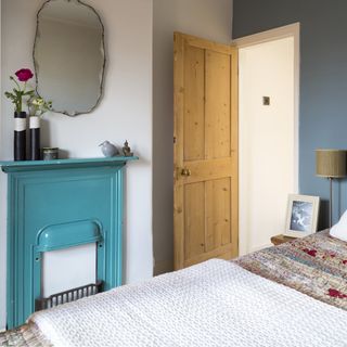 bedroom with white and grey wall and wooden door