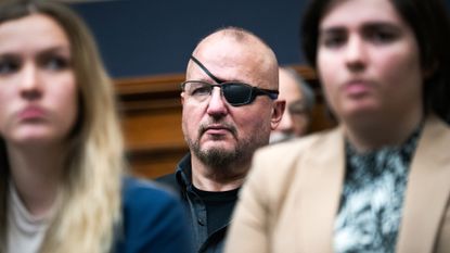 Oath Keepers leader Stewart Rhodes attends House hearing