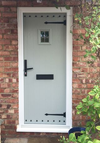 Linton Cottage Door In Agate Grey With Wrought Iron by Evolution Windows