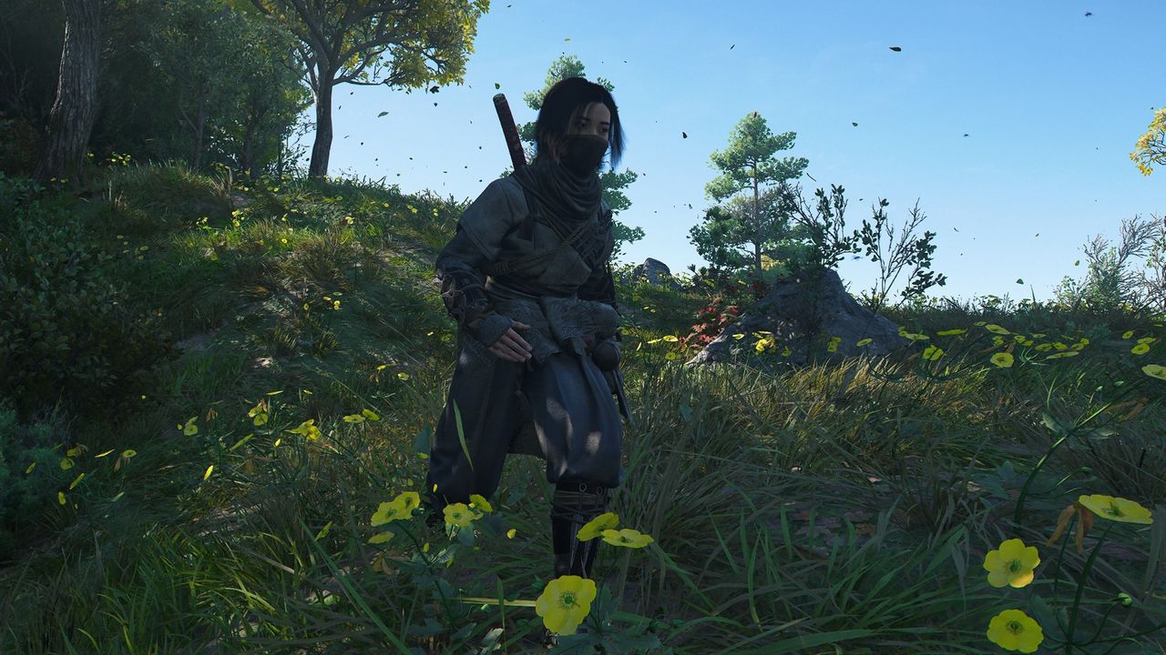 Assassin's Creed Shadows screenshot of Naoe walking among a flowers in a field