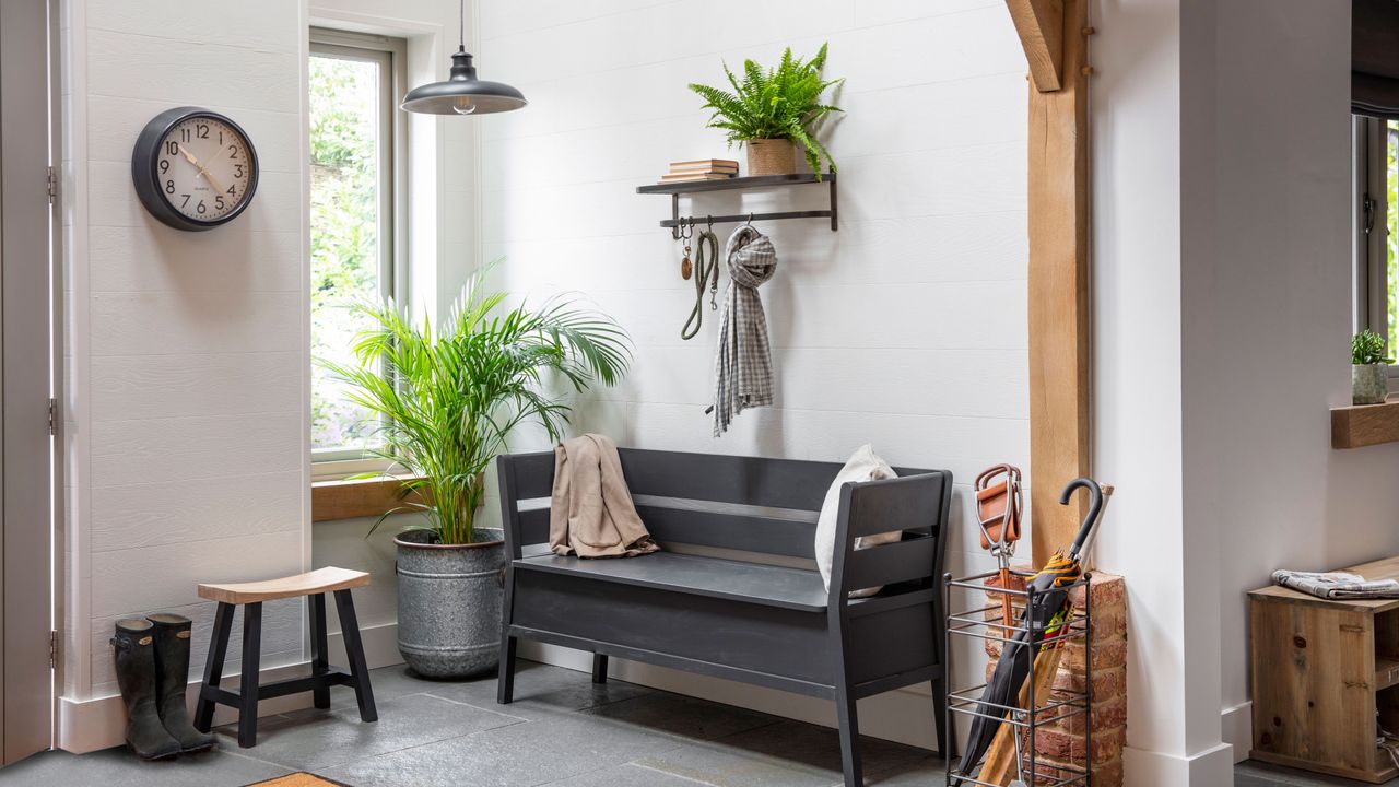 hallway with white walls and bench to sit on and hallway lighting by garden lighting