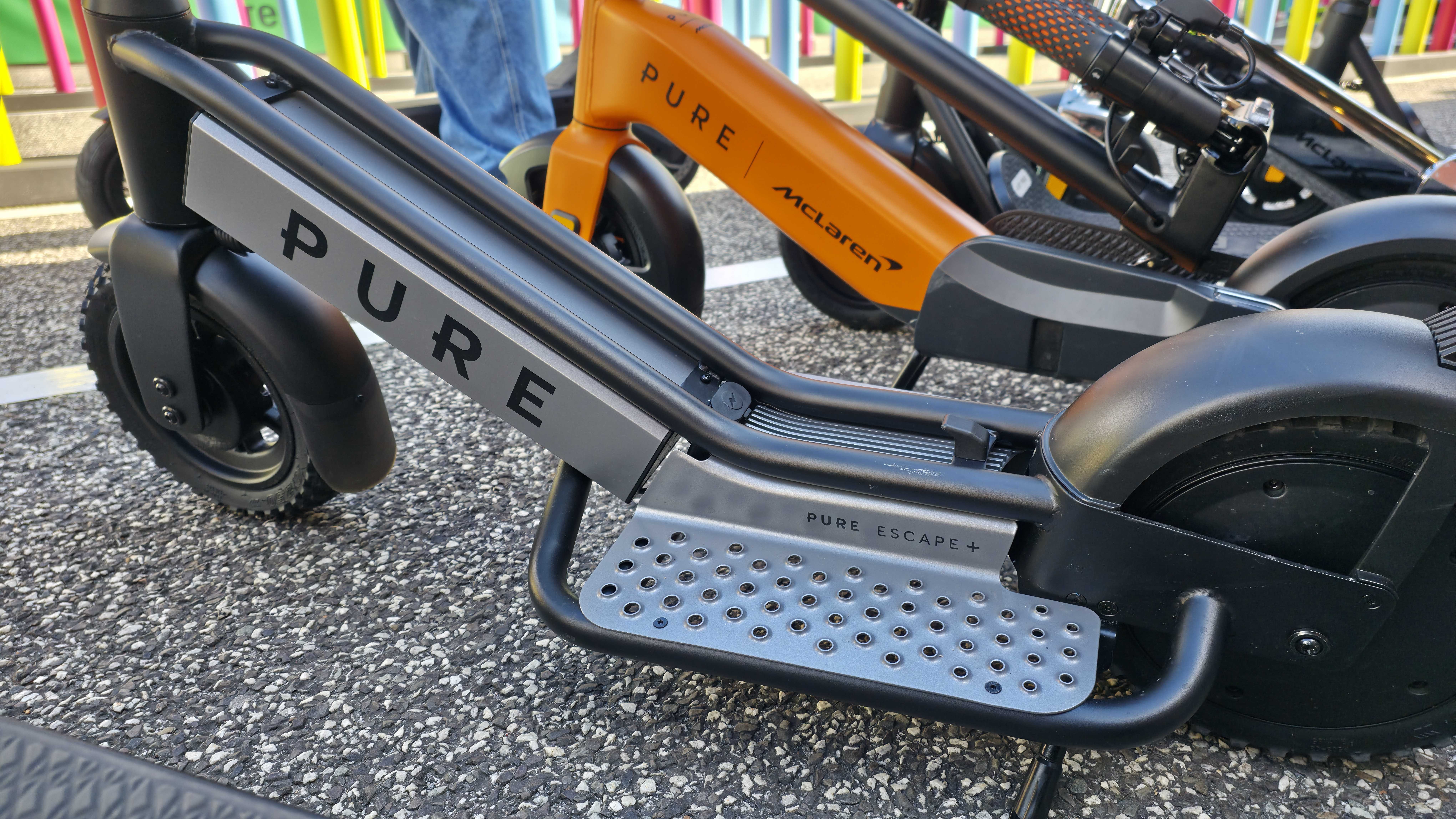 Pure Electric scooters at IFA 2025, it&#039;s a sunny day and the stand is forward facing.