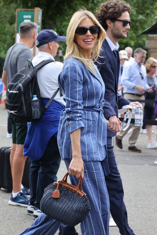 Sienna Miller attends day seven of the Wimbledon Tennis Championships at All England Lawn Tennis and Croquet Club at All England Lawn Tennis and Croquet Club on July 09, 2023 in London, England