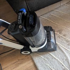 Tineco Carpet One Cruiser being used to clean fresh coffee stain from rug