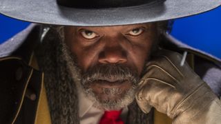 Samuel L. Jackson stares down the camera in a winter cabin in The Hateful Eight