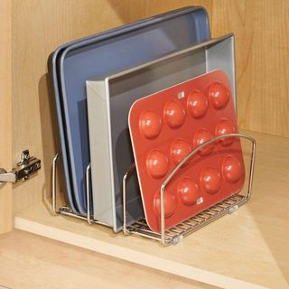 red muffin tray with steel rack and wooden cupboard