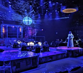 Views from Theatre Raleigh’s recent production of Natasha, Pierre & The Great Comet of 1812, with the stage lit in vivid color by elektraLite.