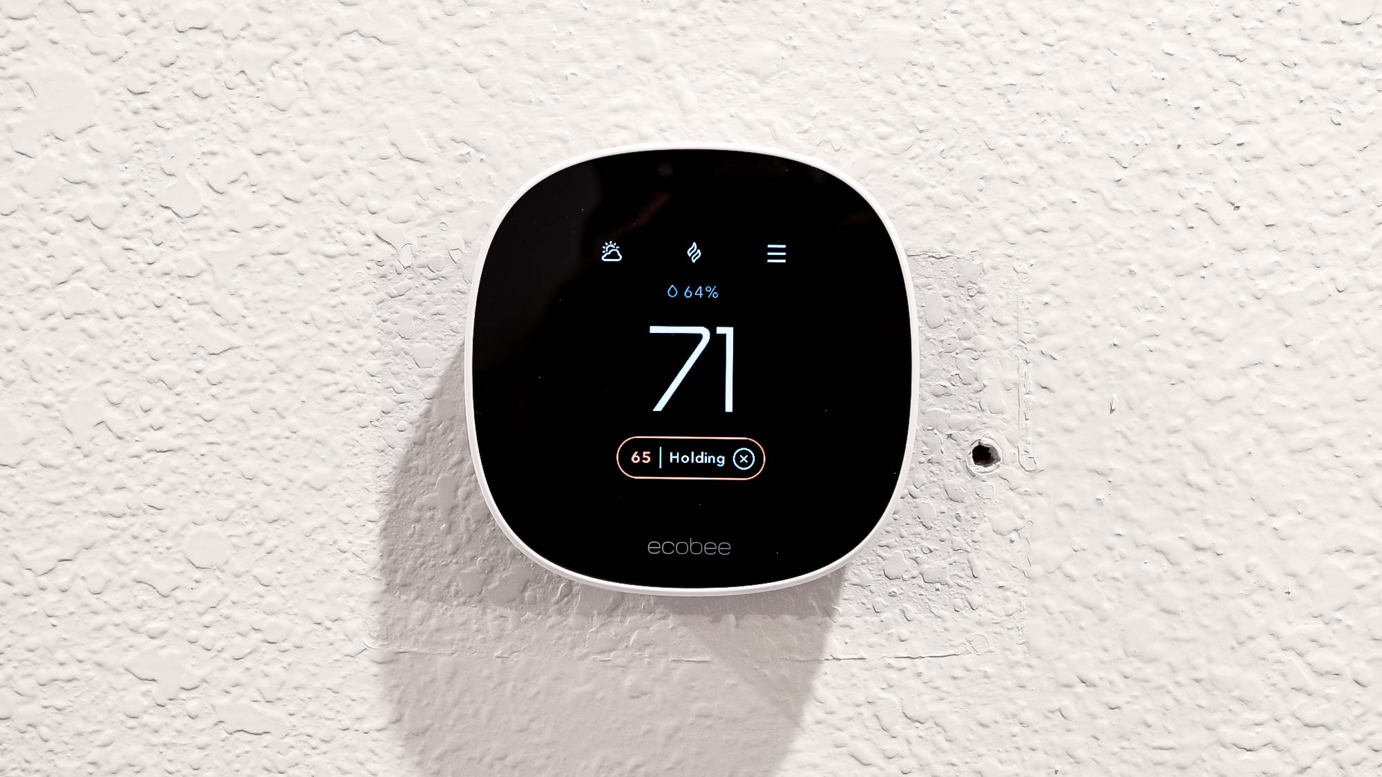 Ecobee Smart Thermostat Essential attached to wall