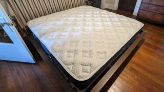 The Brooklyn Bedding Signature Hybrid with Cloud Pillow Top mattress on a bed