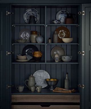 Moody dark kitchen pantry styled with kitchenalia