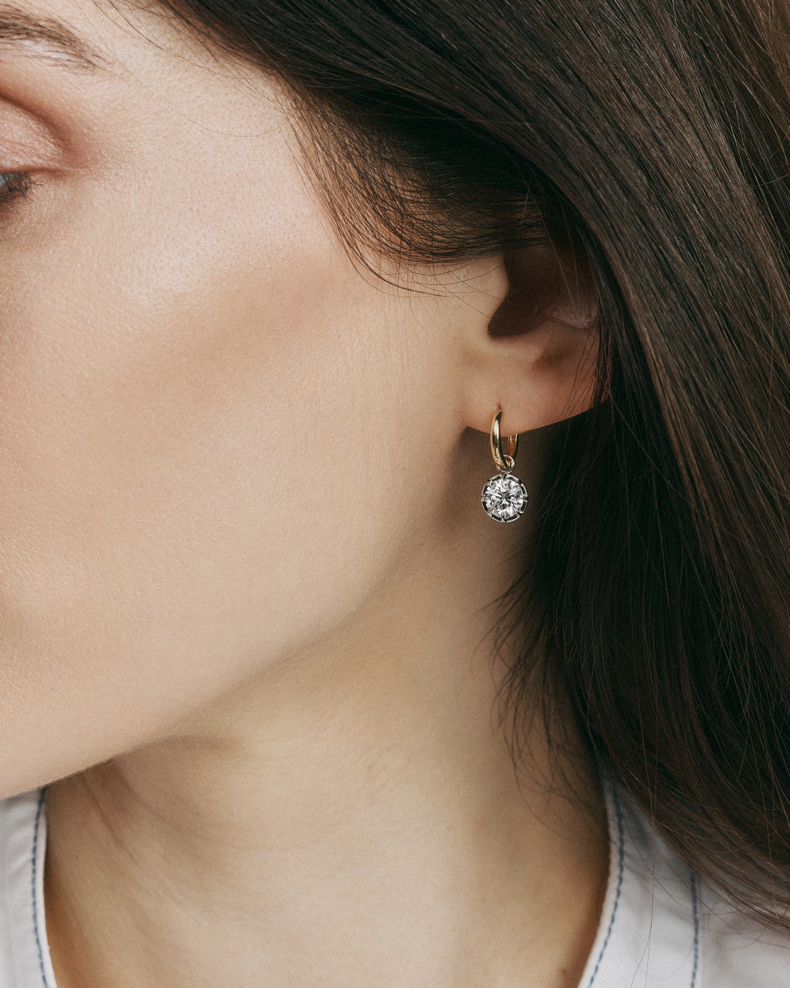 Steph Mazuera model wears Georgian-set diamond earrings.