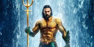 Jason Momoa as Aquaman in full costume and trident in 2018 DCEU film