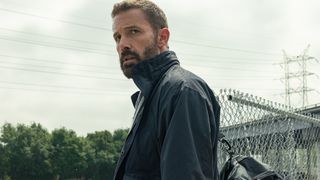 Mark Kimball (Ben Affleck) looks over his shoulder while carrying the ransom money in Animals.
