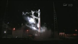 SpaceX Falcon 9 rocket and Dragon capsule on the launch pad after May 19, 2012 launch abort.
