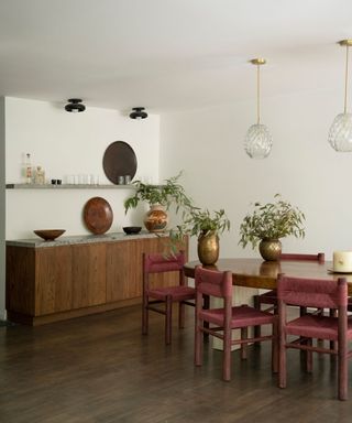 dining room with white walls wooden furniture