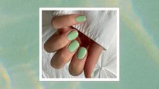 A close up picture of a hand with mint green nails by nail artist @gel.bymegan/ in a green water-effect template with slight rainbow reflections