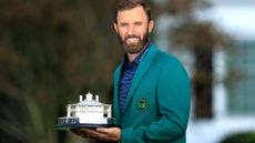 Dustin Johnson holding Masters trophy after The Masters 2020 GettyImages-1346808385