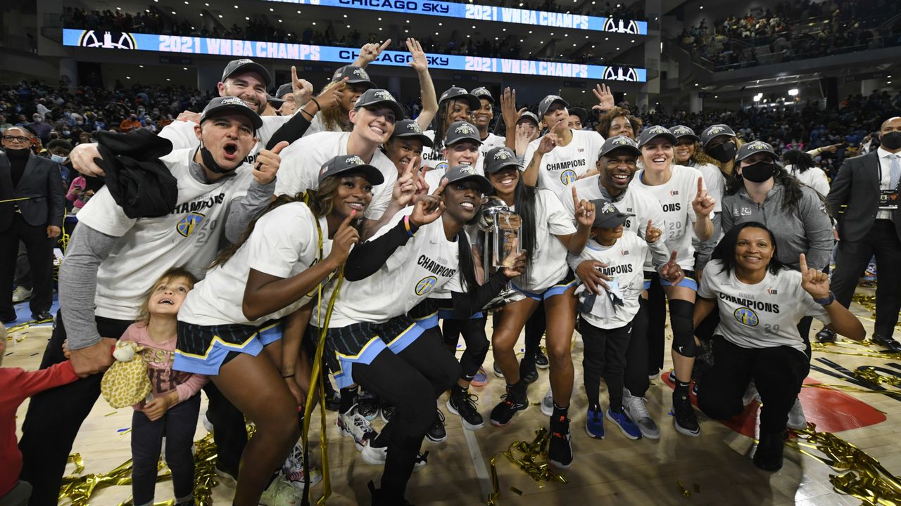 Chicago Sky players celebrate their win.