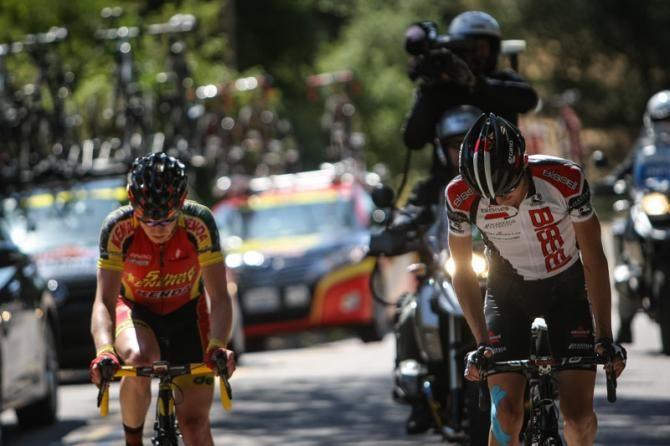 The last two riders in the break feeling the heat of the day.