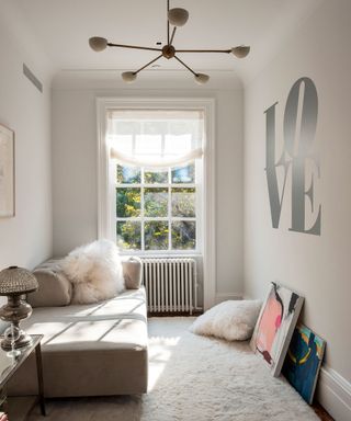 bedroom with light pink wall and cushion