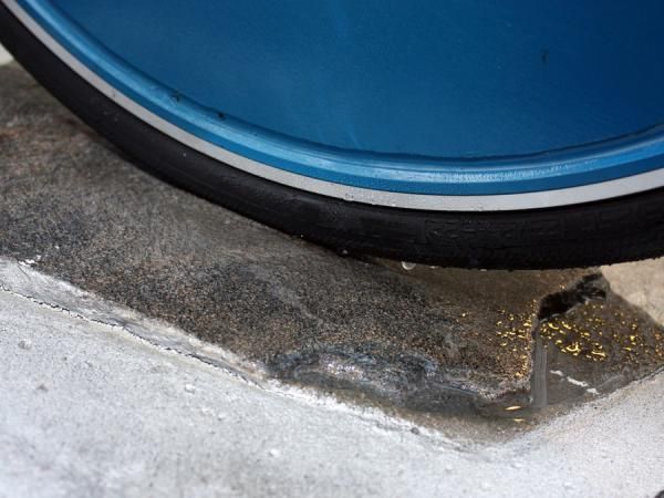 Water is applied to the tyres to simulate wet-weather traction.