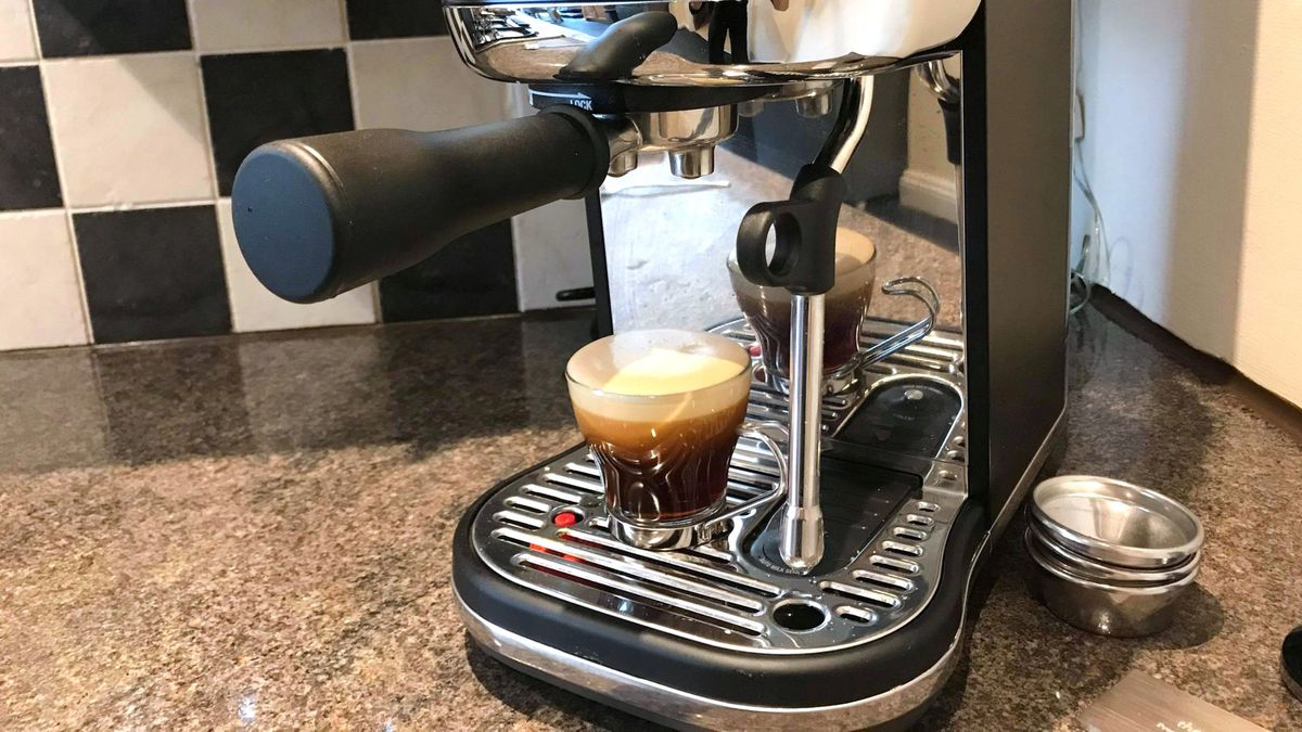 Breville Bambino Plus coffee maker on kitchen counter