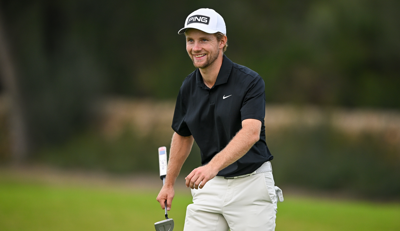 Rasmus Neergaard-Petersen smiles as he walks off the green