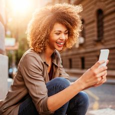 woman smiling on phone 