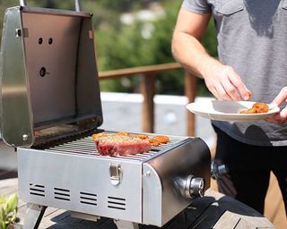 steak being cooked on the Cuisinart Professional Portable Gas Grill