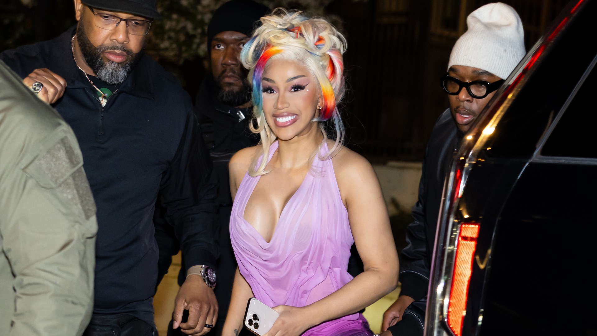 a paparazzi photo of cardi b wearing blonde hair with colorful streaks