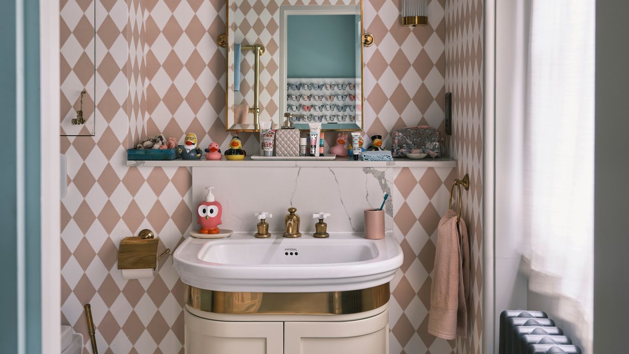 a kids bathroom with harlequin wallpaper