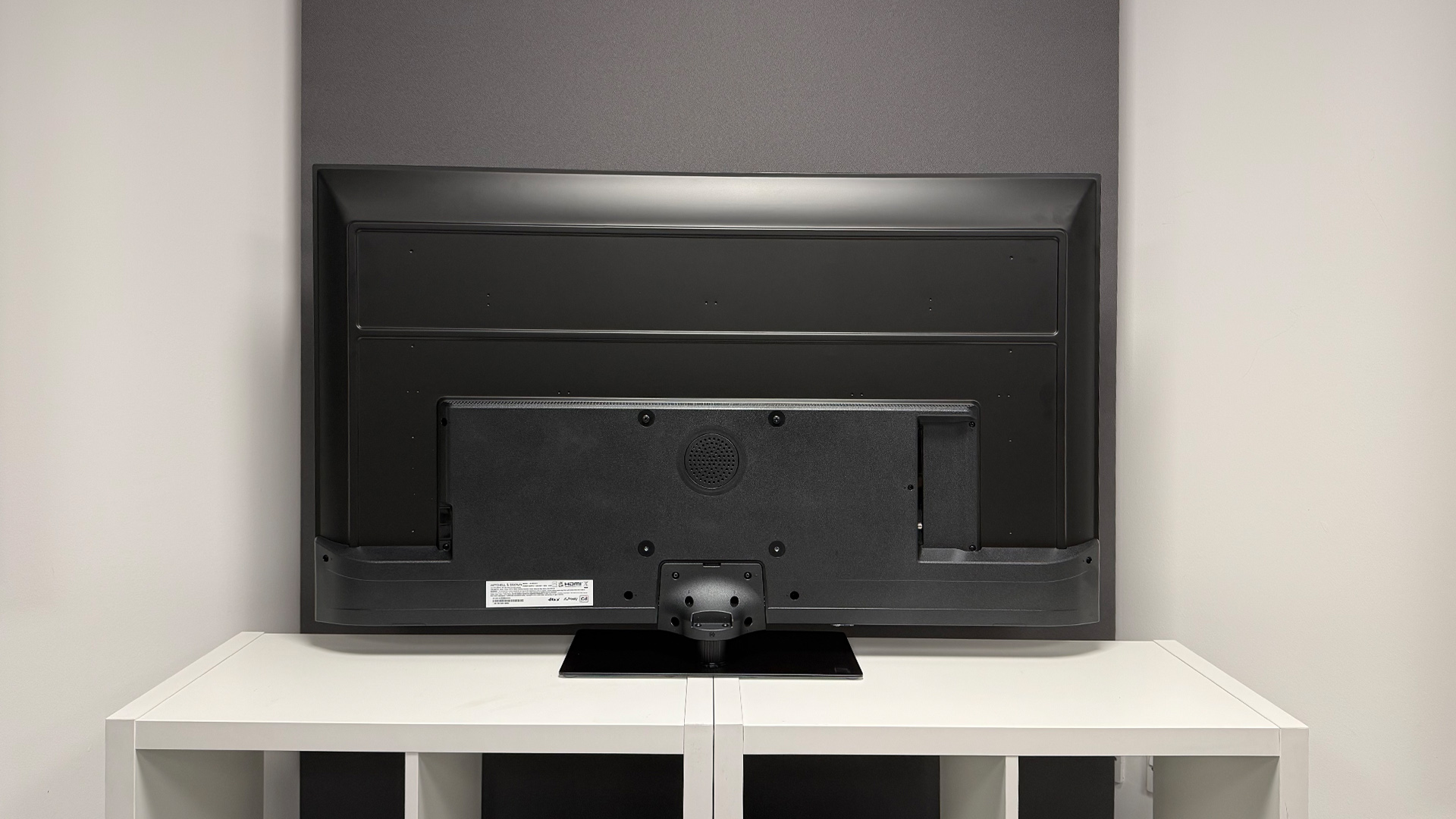 Mitchell &amp;amp; Brown QLED1811 QLED TV on white shelving unit, rear of set