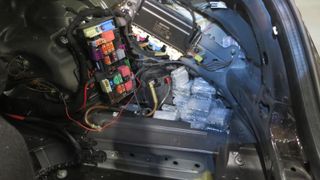 Photograph of the CPU smuggling setup built into the trunk of a car.