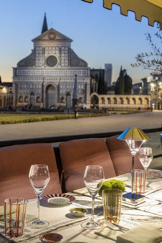 The Place Firenze offers outdoor sitting with views of beautiful Florence