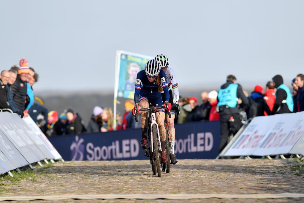 COL DU VAM DRENTHE NETHERLANDS NOVEMBER 07 Line Burquier of France ahead of Fem Van Empel of Netherlands pass through the finishing line on last lapduring the 19th UEC European Cyclocross Championships 2021 Womens U23 EuroCross21 UECcycling on November 07 2021 in Col du Vam Drenthe Netherlands Photo by Luc ClaessenGetty Images