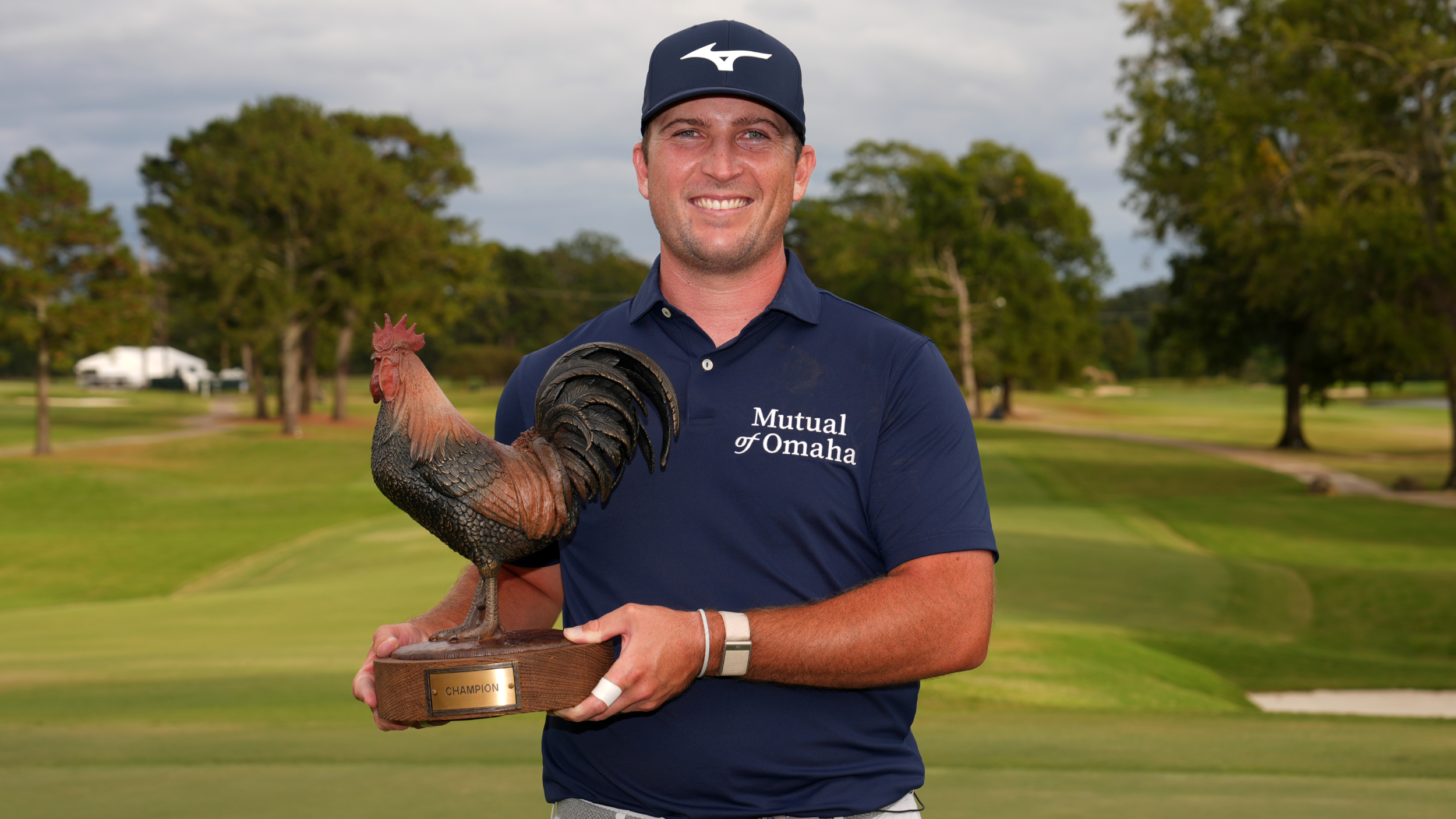 Steven Fisk with the Sanderson Farms Championship trophy 