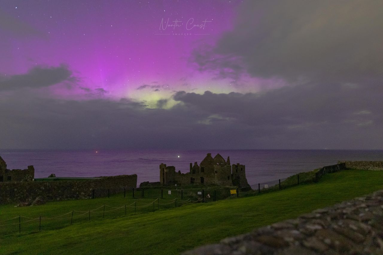 Northern lights above Dunluce Castle, Co Antrim, Northern Ireland captured by photographer North Coast Snapper.