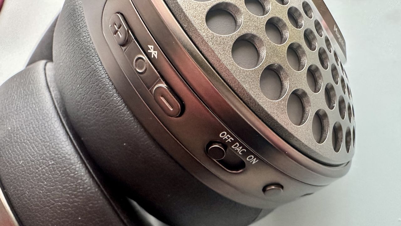 Focal Bathys Mg in bronze, featuring ear cup detail on gray background