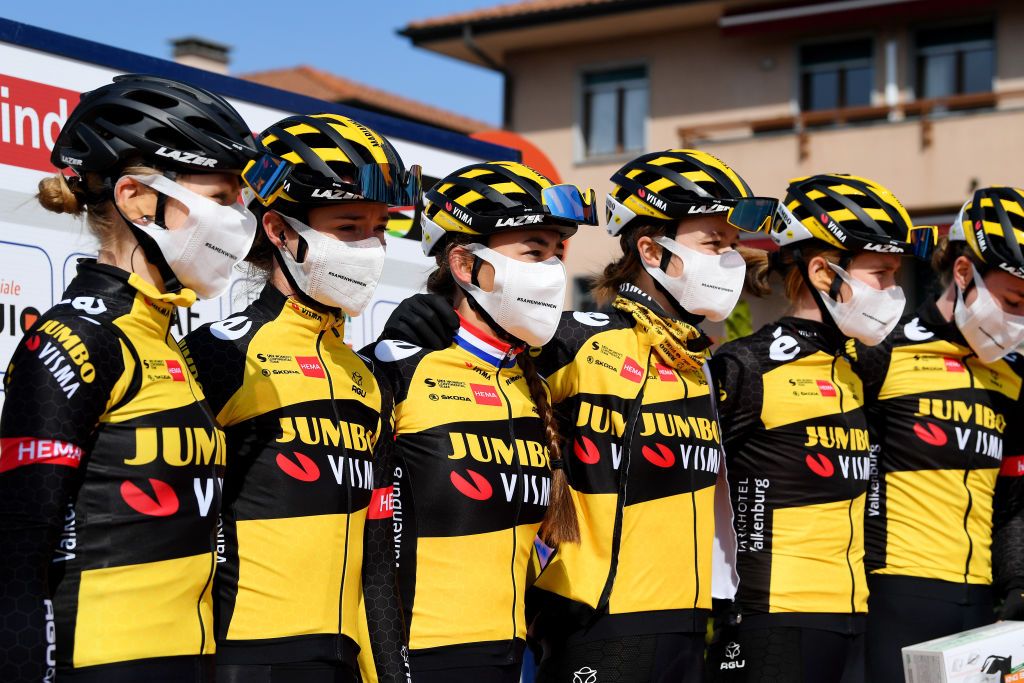 CITTIGLIO ITALY MARCH 21 Start Podium Marianne Vos of Netherlands Teuntje Beekhuis of Netherlands Riejanne Markus of Netherlands Anouska Helena Koster of Netherlands Nancy Van Der Burg of Netherlands Julie Van De Velde of Belgium and Team Jumbo Visma during the 45th Trofeo Alfredo BindaComune di Cittiglio 2021 Womens Elite a 1418km stage from Cocquio Trevisago to Cittiglio 257m Mask Covid safety measures Team Presentation TrBinda UCIWWT on March 21 2021 in Cittiglio Italy Photo by Tim de WaeleGetty Images