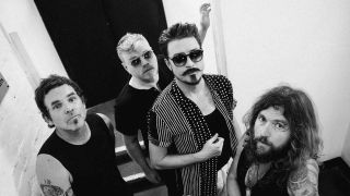 Rival Sons standing in a stairwell