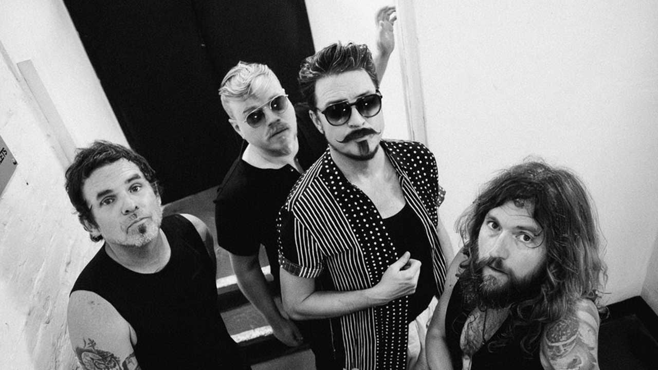 Rival Sons standing in a stairwell