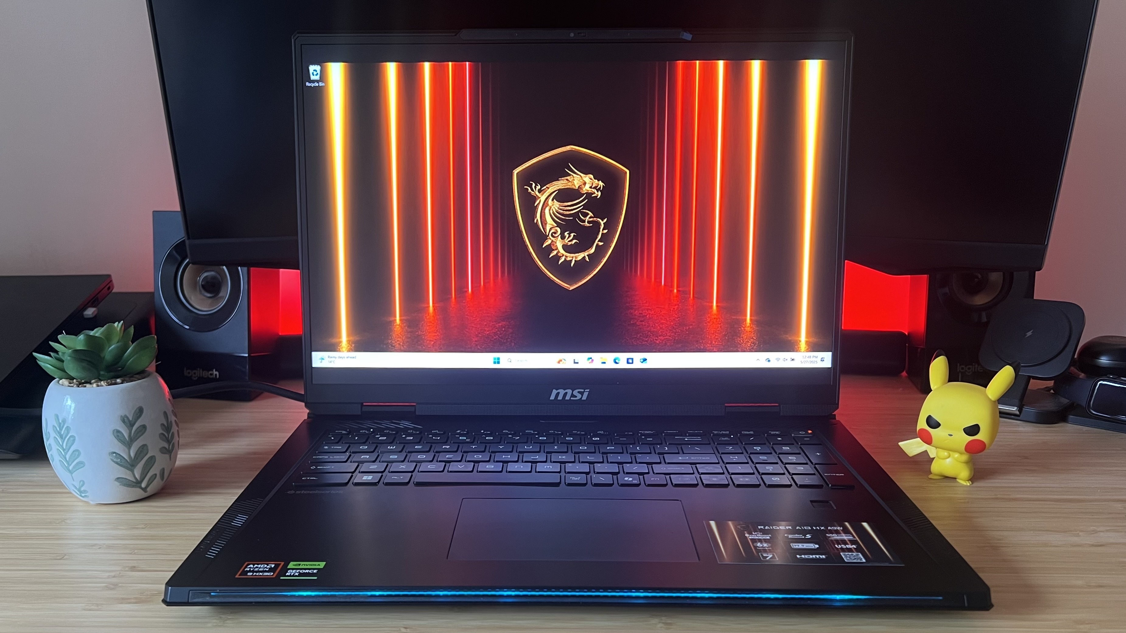 MSI Raider A18 HX gaming laptop on a wooden desk