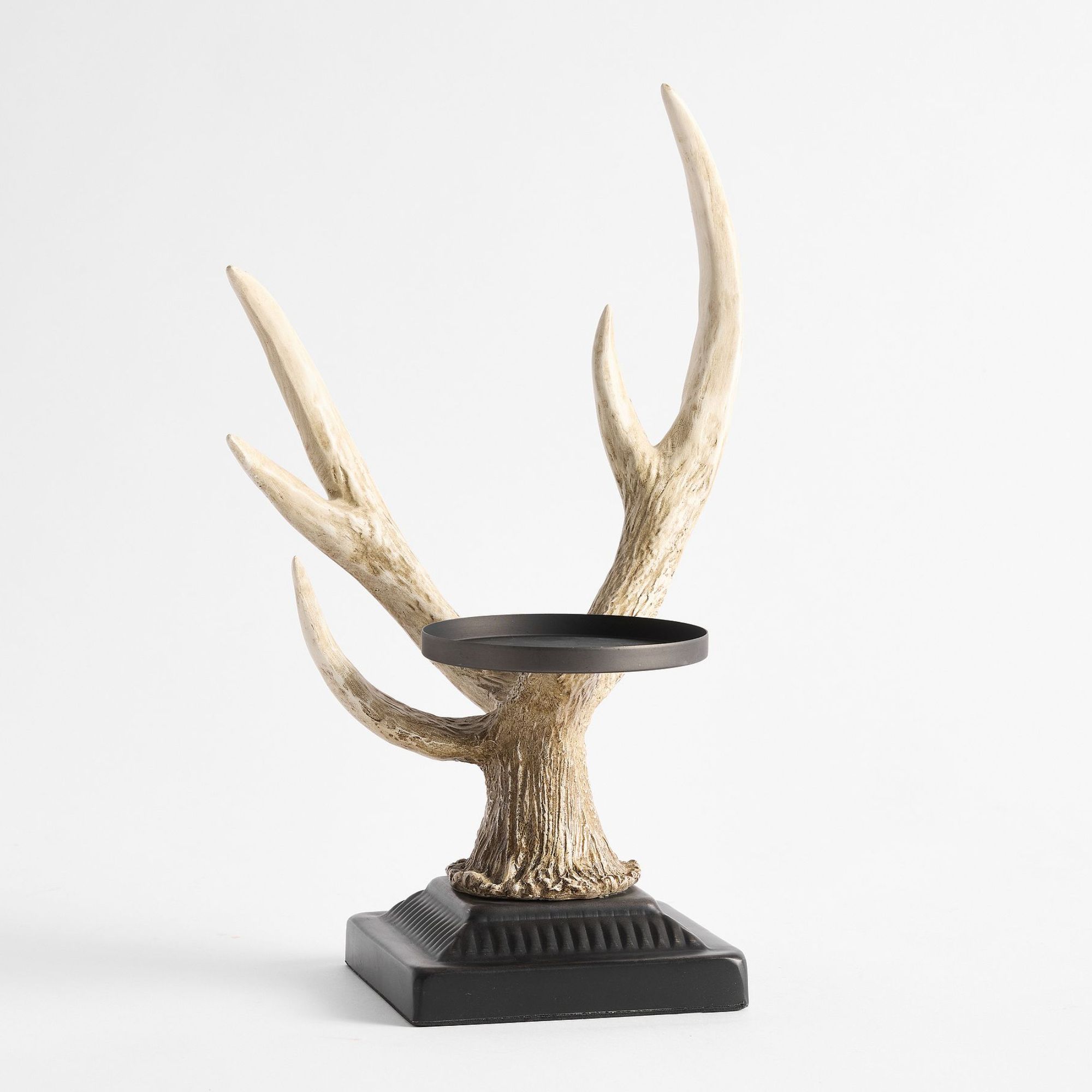Black pillar candle holder with faux antler design
