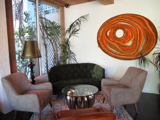 Green sofa, two arm chairs and coffee table